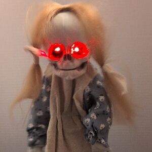 Creepy Haunted Looking Doll, Red Eyes, Cries And Jumps.